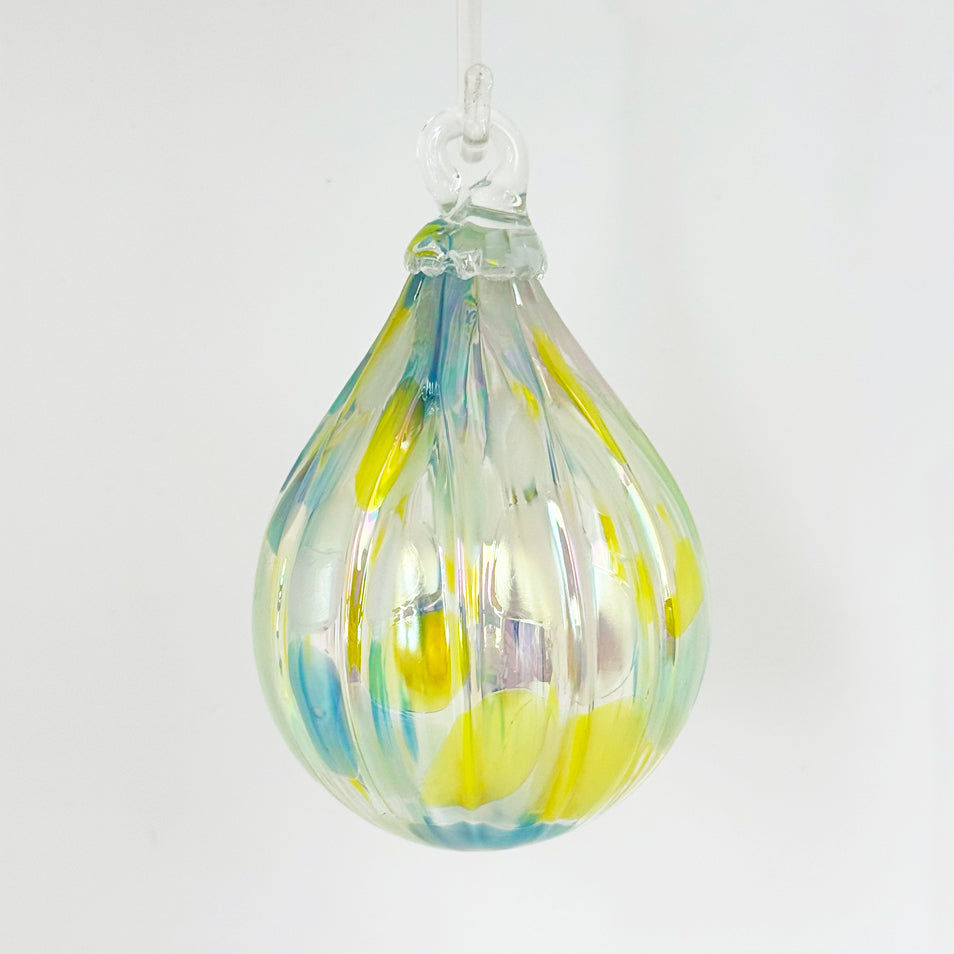 Buttercup glass ornament from the Lacey Collection features beautiful color blends and a unique teardrop shape.