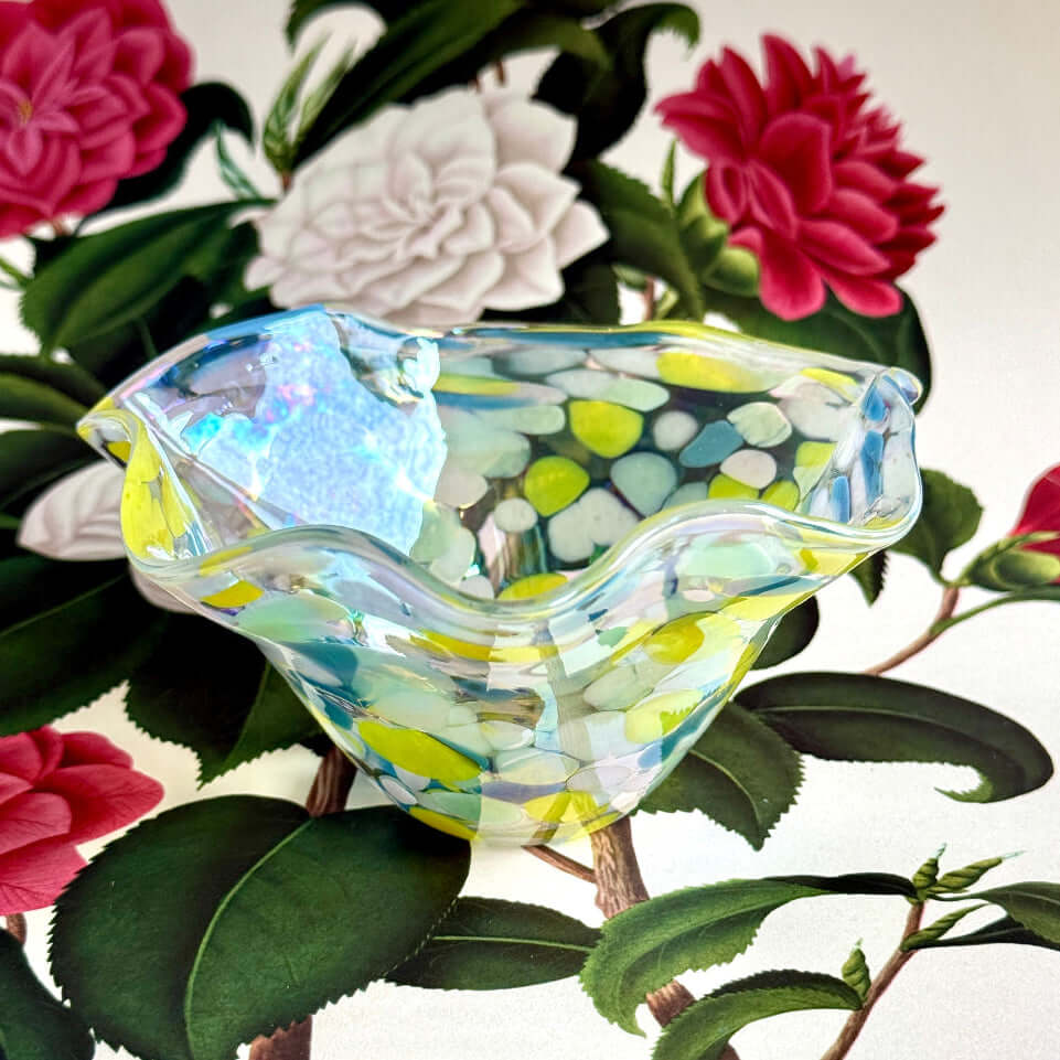 Buttercup decorative glass bowl featuring vibrant colors and a unique shape, ideal for artistic display.