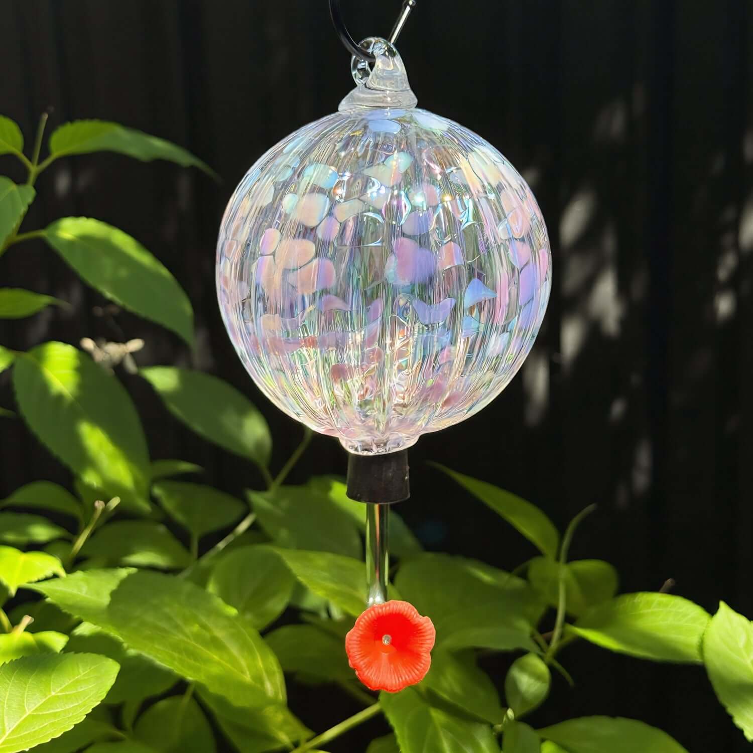 Bellflower hummingbird feeder with iridescent finish and red flower, perfect for attracting birds to your garden.