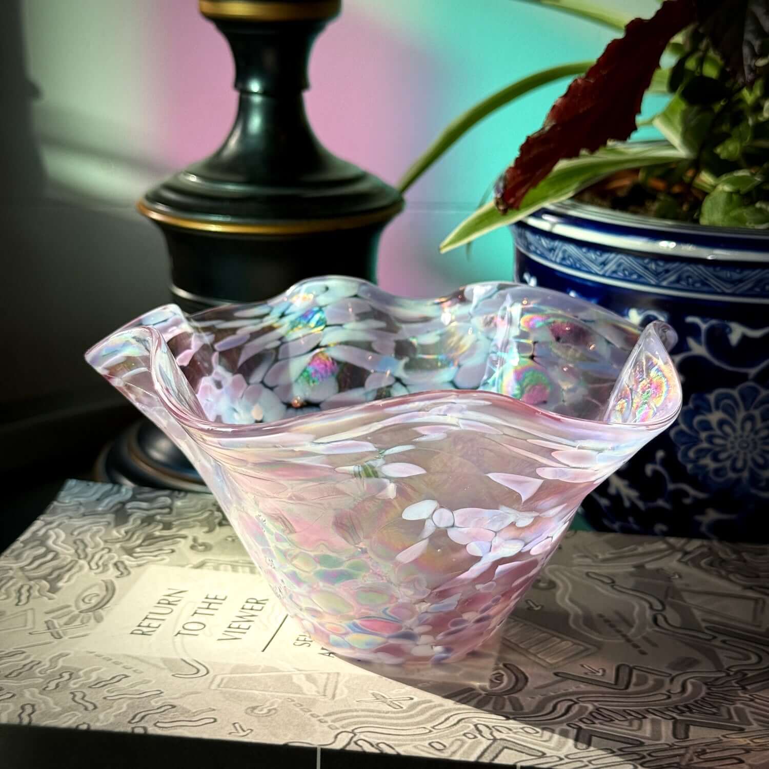 Handmade Bellflower wave bowl featuring an iridescent finish shifting between periwinkle, lavender, and pearl.